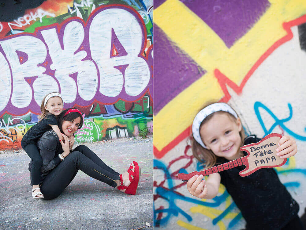 Portrait de maman et sa fille devant des graffitis pour la fêtes des pères.